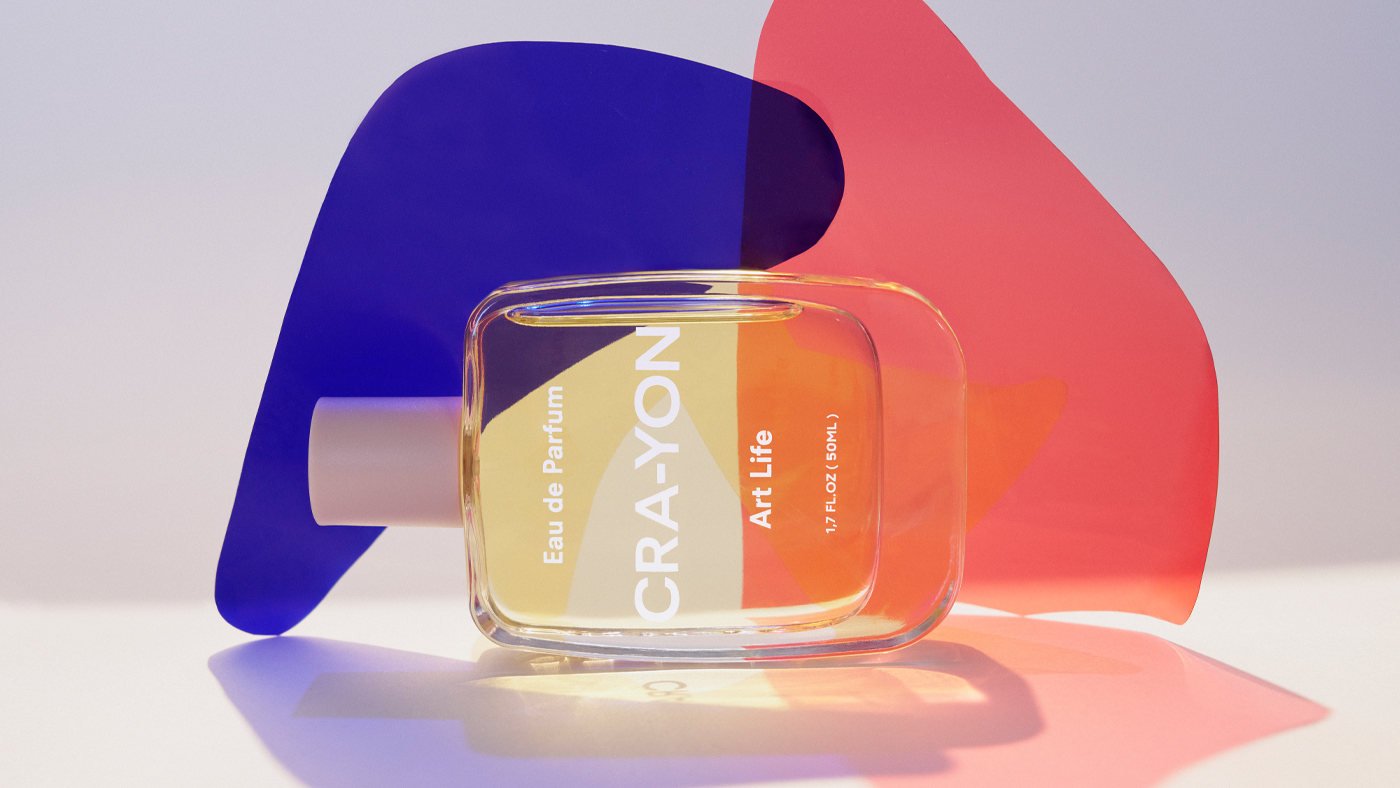 CRA-YON 'Art Life' Eau de Parfum bottle with abstract red and purple light shapes on white background