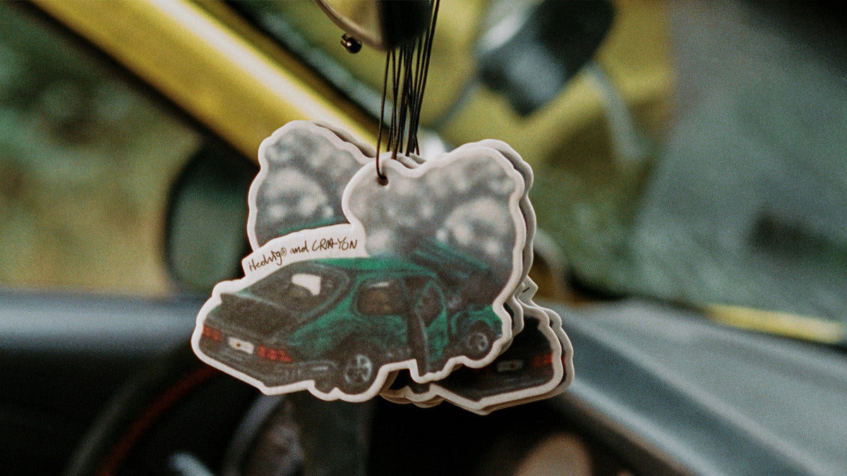 SCENT CARDS for a Car hangin in the rearview mirror of a rally car. The scent of burnt rubber in collaboration between HEDVIG and CRA-YON. 