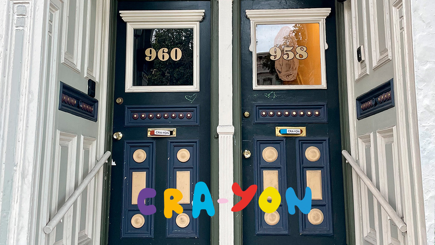 Two ornate navy doors numbered 960 and 958 with colorful CRA-YON logo across the bottom