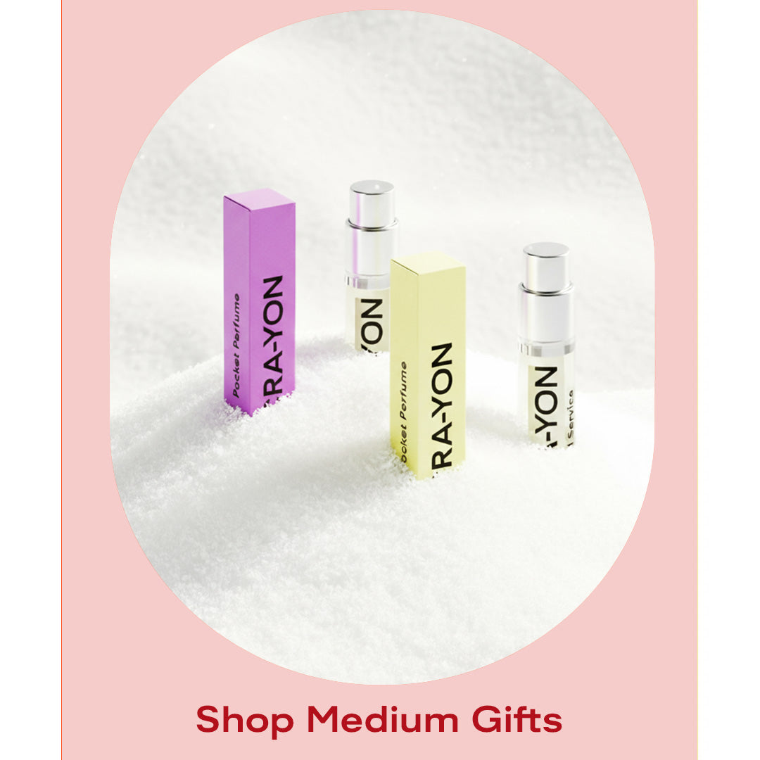 Stack of CRA-YON perfume boxes in multiple colors – shop medium fragrance gifts.