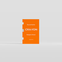 Passport Amour Eau de Parfum 2ml sample by CRA-YON in orange packaging, displayed against a light background.