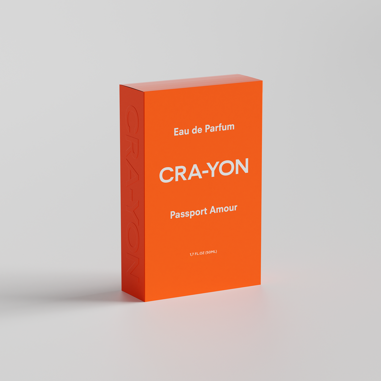 CRA-YON 'Passport Amour' Eau de Parfum box in bold orange packaging, standing on white background