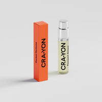 CRA-YON 'Passport Amour' pocket perfume in glass spray bottle with orange box on white background