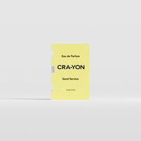 Sand Service Eau de Parfum 2ml sample by CRA-YON in yellow packaging, displayed against a light background.