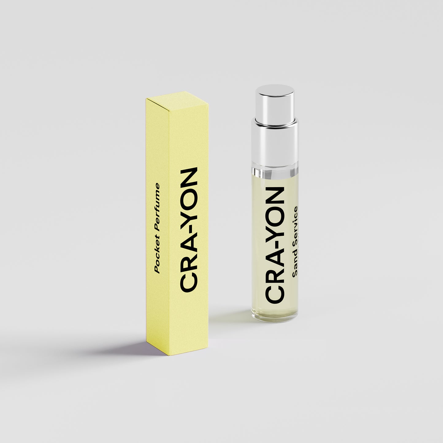 CRA-YON Sand Service – pocket perfume and light yellow box standing on a light background