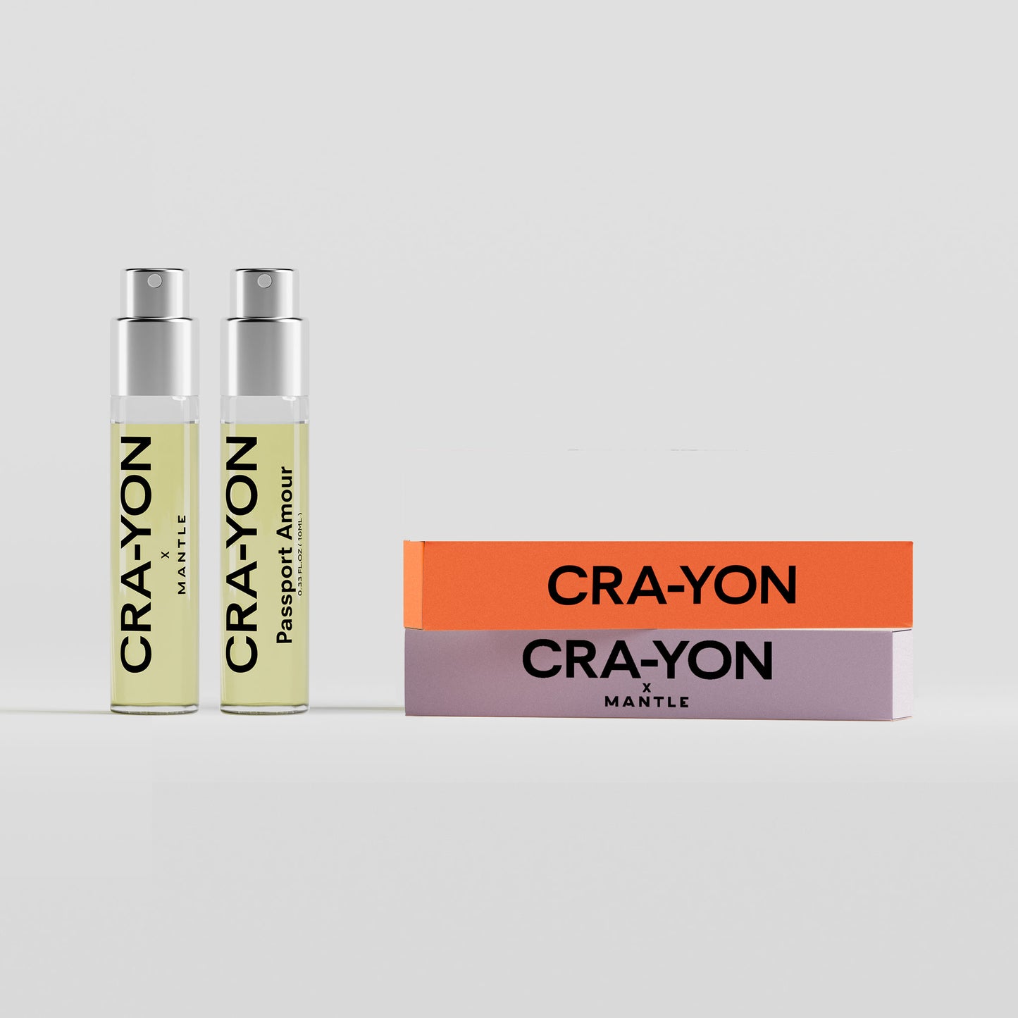 CRA-YON The Fougère Affair & Passport Amour – two travel sprays and flat boxes in orange and lavender on light background