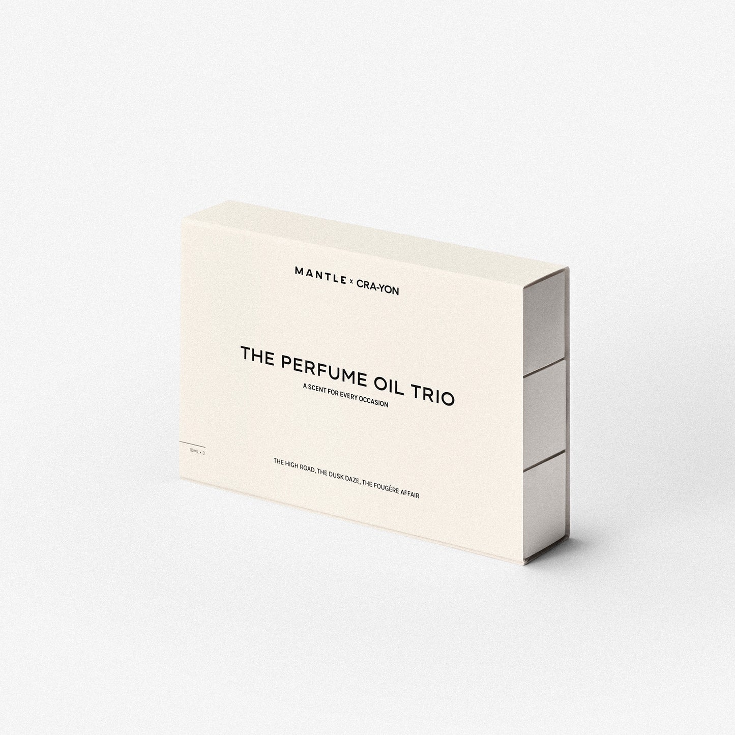 CRA-YON x MANTLE Perfume Oil Trio set with three slim glass bottles and cream-colored box on white background