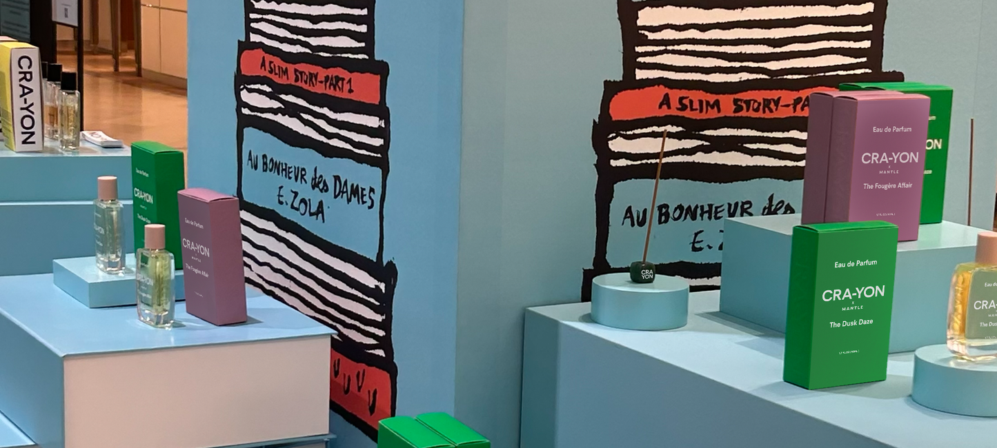 CRA-YON fragrance display featuring The Fougère Affair and The Dusk Daze perfumes in a colorful artistic setup