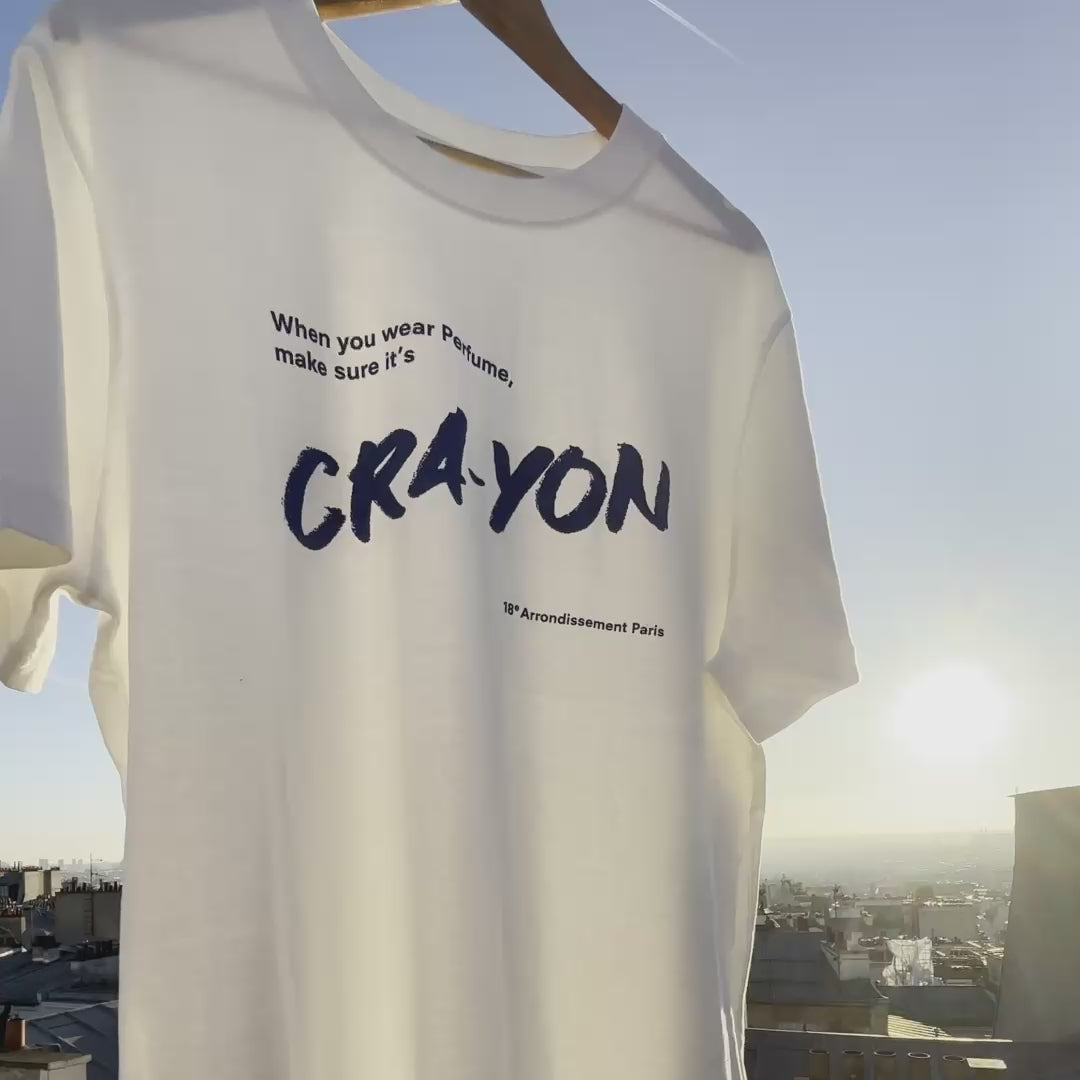 CRA-YON Perfume T-shirt – folded white t-shirt with blue logo print, sky background video
