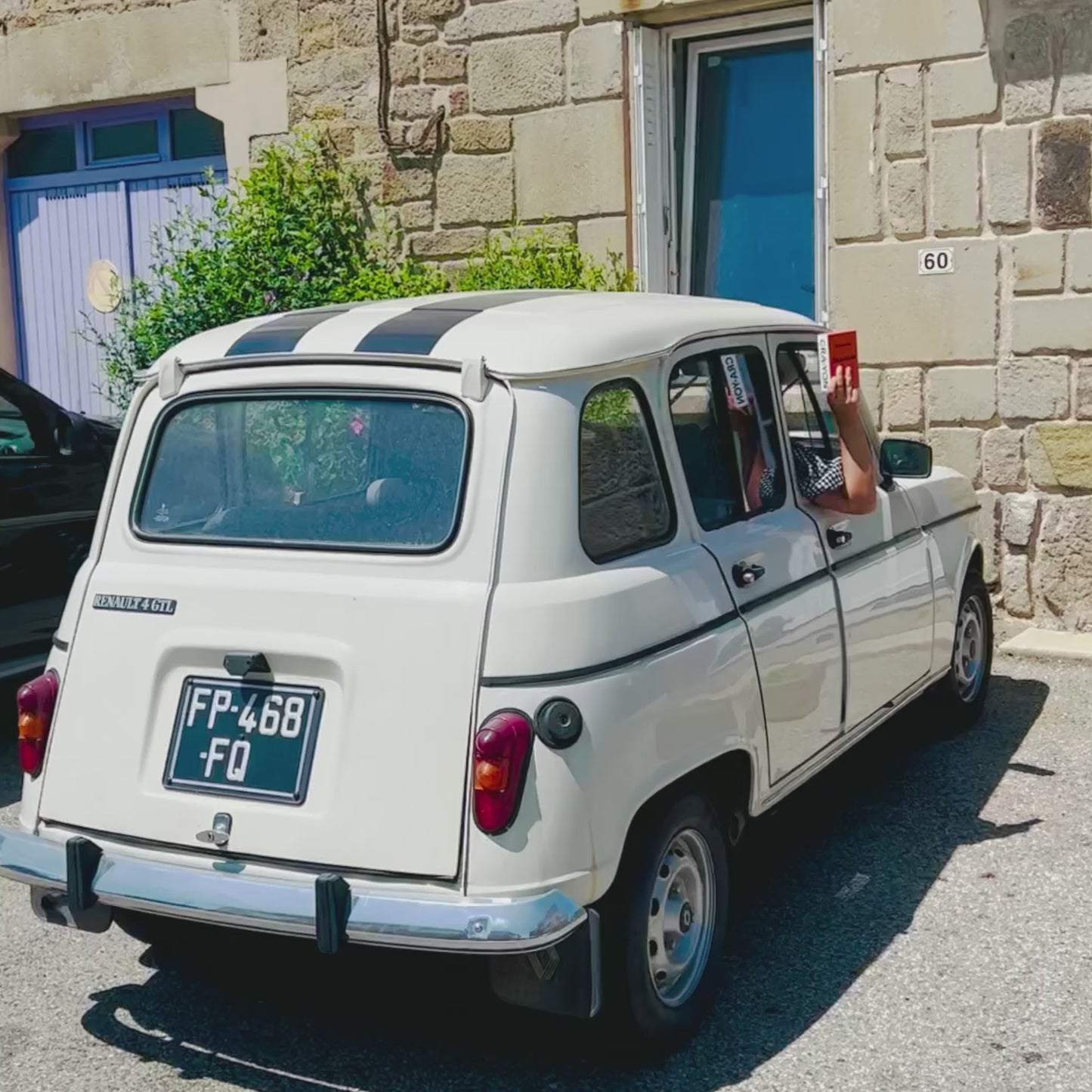 CRA-YON Passport Amour Eau de Parfum in window of a white car