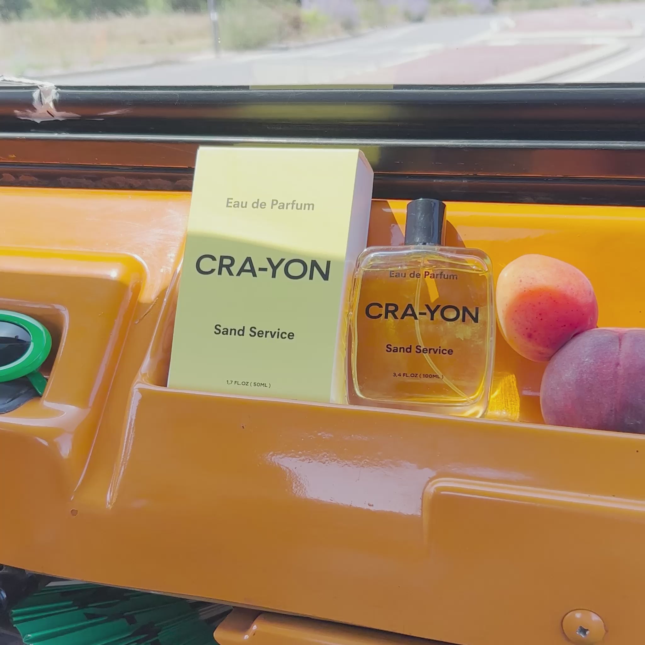 CRA-YON Sand Service Eau de Parfum inside yellow car