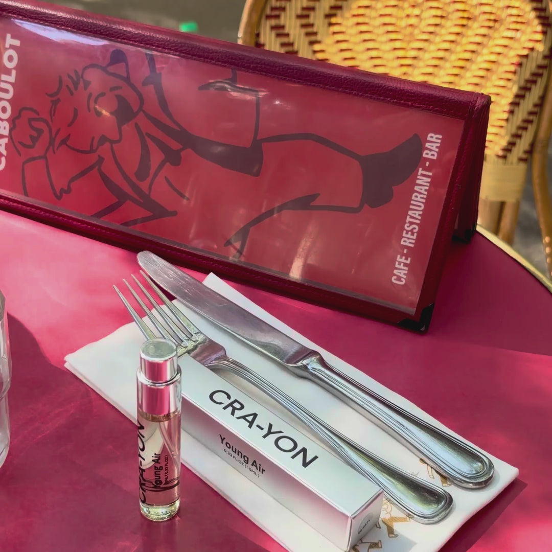 CRA-YON Young Air box and bottle at a bistro cafe table in the sunshine.