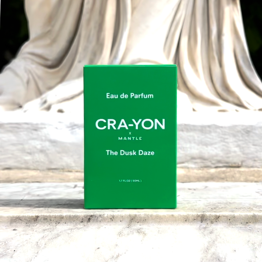 CRA-YON The Dusk Daze green packaging in front of statue